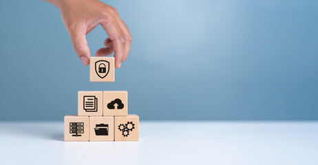 Data Security and Cybersecurity Protection concept with document icons in wooden cube for document...
