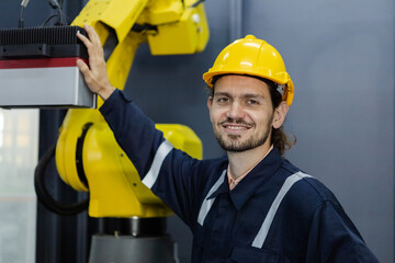 Portrait of happy smiling male engineer workers standing in manufacturing factory workplace. professional technician production at factory.