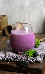 blueberry-flavored collagen drink with a minimalist photo concept of bright mood and darkmood