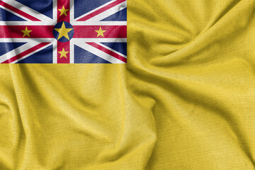 Niue country flag background realistic silk fabric