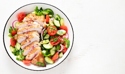 Salad with chicken meat. Fresh vegetable salad with chicken breast. Meat salad with chicken fillet and fresh vegetables on plate.