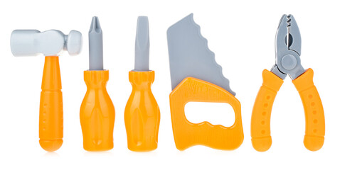 A set of toy tools isolated on a white background. Working tools for children: hammer, wrench, saw, screwdriver. Plastic tools for builder games. Role-playing games for children
