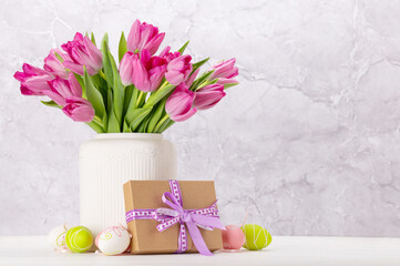 Fresh pink tulip flowers and easter eggs