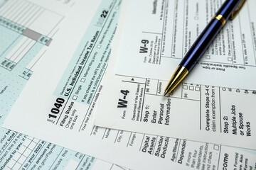 blank tax form 1040 w4 w9 on office desk, deadline
