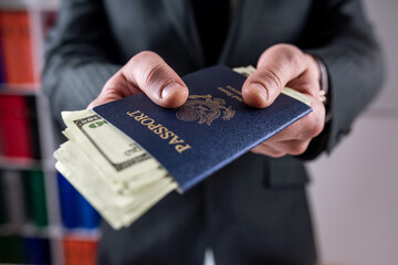 Business man hold USA passport with dollar for traveler