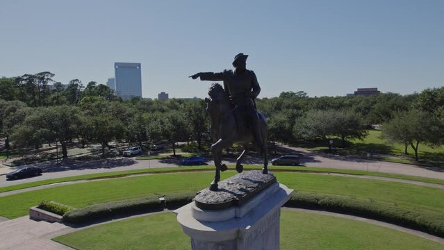 Aerial - Close up of Sam Houston Statue with traffic and people - Houston, TX