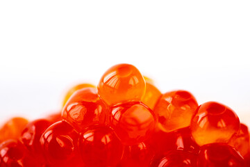 Mountain of red caviar on a white background. Large red caviar with space for text. Red caviar on a white background with space for copywriting
