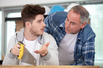 young apprentice is talking to teacher