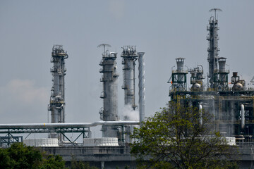 Industrial oil and gas refinery plant form industry zone and 0il storage at sunset.