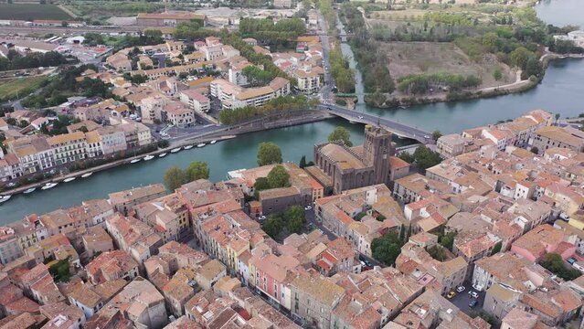 Scenic cityscape of town Agde and River Herault, southern France