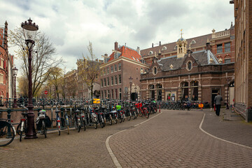 A Amsterdam street in spring with colorful houses in the style of classical Dutch architecture, 