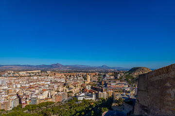 Fototapeta na wymiar view on a sunny day of the city and colorful buildings from the viewpoint Alicante Spain