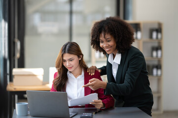 Happy multiracial business team discussing the concept of their project together in the meeting room.