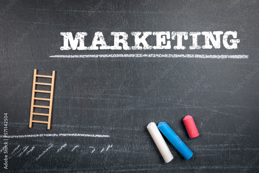 Canvas Prints marketing concept. text and colored pieces of chalk on a blackboard background