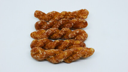 “Kue Pelintir” pastries The name is cake twist, the sweet taste of Indonesian palm sugar, isolated white background