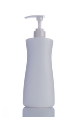 Plastic bottle with soap or shampoo reflected on white background