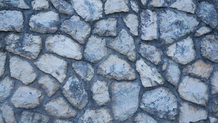 Texture of gray stone. Wall tiles in grey. Stone tiles. The texture of the stone.