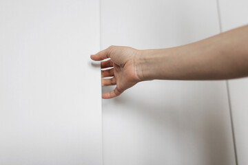 hand open wardrobe or cupboard door