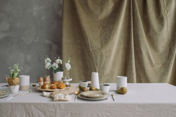 Aesthetic breakfast at home. Delicious table setting for family Easter meal. Copy space.