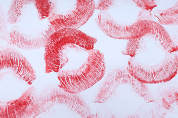 White background with lipstick kisses, close up