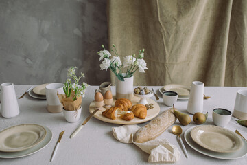 Aesthetic breakfast still life at home. Delicious table setting for family Easter meal.