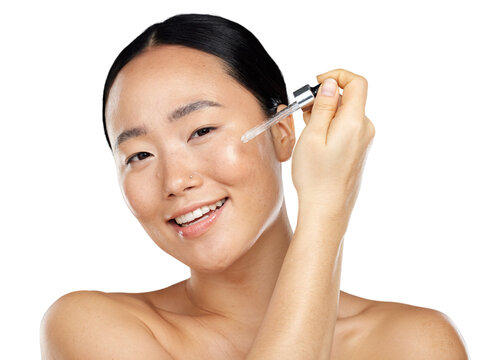 A topless asian young girl with a soft and smoth skin using a skincare, facial serum, hyaluronic acid cosmetic product and essential oil isolated on a png background.