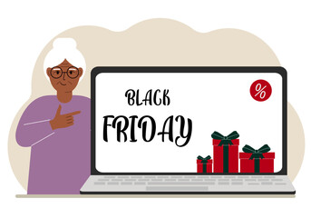 A old woman next to a large laptop, on his screen the text black friday and a lot of gift boxes.