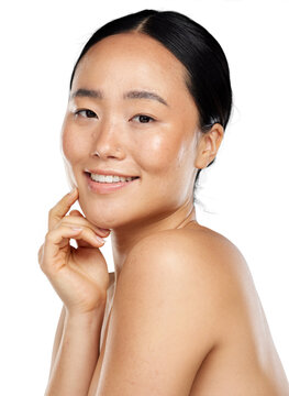 A topless assian girl posing for a healthy skin care or cosmetic product for different spa treatment looking at the camera isolated on a png background.
