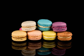 Colorful macaroon over black background