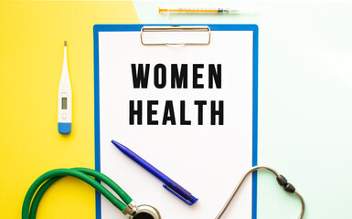 WOMEN HEALTH text on a letterhead in a medical folder on a beautiful background.
