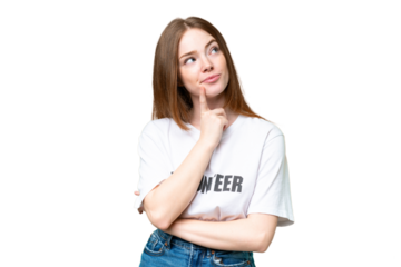 Young volunteer woman over isolated chroma key background having doubts while looking up