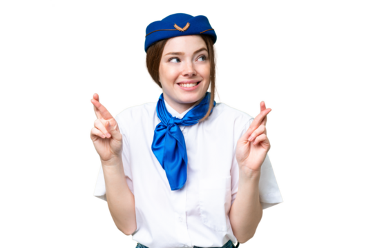 Airplane stewardess over isolated chroma key background with fingers crossing