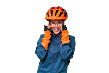 Young cyclist woman over isolated chroma key background with glasses and surprised - obrazy, fototapety, plakaty