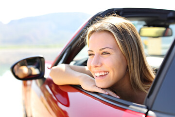 Happy car convertible driver laughing