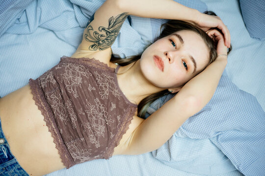 woman is lying on the bed