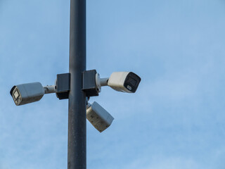 Surveillance camera for security. The concept of protection of society. Face recognition. Program for finding criminals.