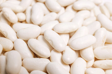 Lots of white beans. Texture background. Top view