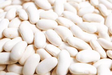 Lots of white beans. Texture background. Top view