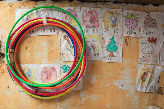 hula hoop and children's art hang o the wall in rural school classroom