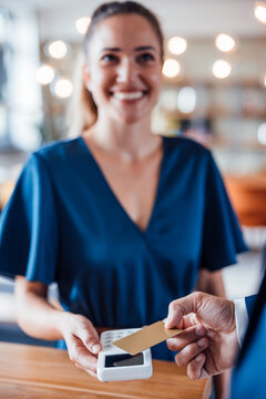Business people using contactless payment method at office
