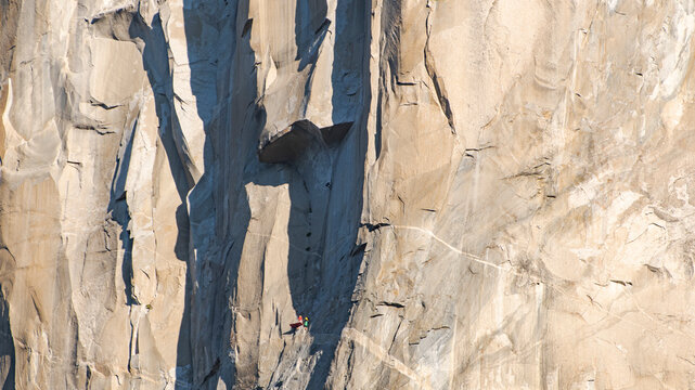 Athlete climbing the Great Roof on the Nose, El Capitan, at sunrise