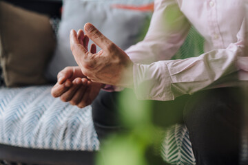 Hands of businessman gesturing in office