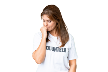 Middle age volunteer woman over isolated background having doubts