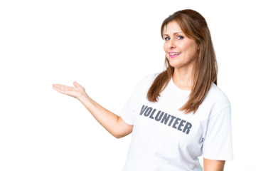 Middle age volunteer woman over isolated background extending hands to the side for inviting to come
