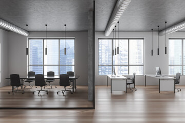 Office interior with meeting room and workspace near panoramic window