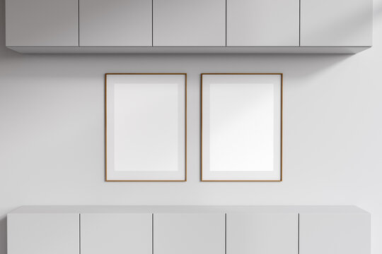 Bright gallery room interior with two empty white posters