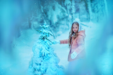 Beautiful little girl with long hair. Little girl in the winter forest. girl in a white knitted scarf. Girl in a Zara sheepskin coat. Little girl at the spruce. Snow. A little girl is standing by a tr