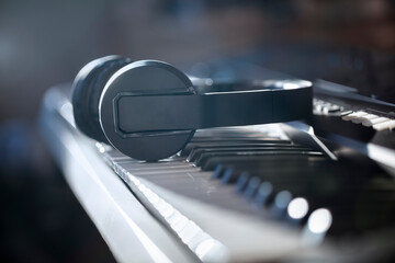 Piano keyboard and headphones concept for live music, tuition, lessons and education