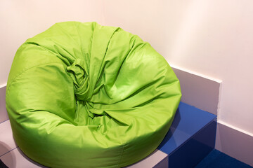 Green bean bag chair in the room