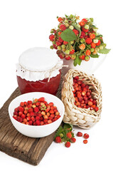 strawberry branches, jam on a wooden board